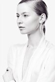 A young woman wearing a white chiffon blouse (black-and-white shot)