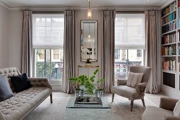Pale upholstered seating in elegant living room