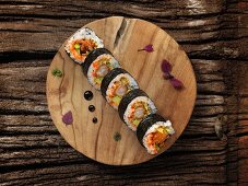 Futomaki sushi with shrimps, caviar and avocado