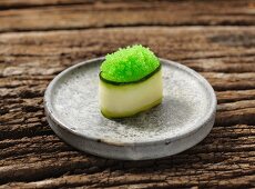 Gunkan maki sushi with green caviar