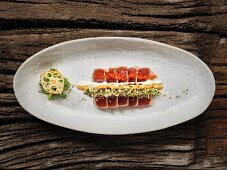 Sushi with tuna fish, chilli mayonnaise and herbs