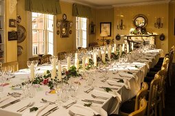 Table festively set for birthday dinner in dining room of private Georgian house in Suffolk, England.