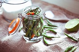 Pickled bird's eye chillis in a flip-top jar