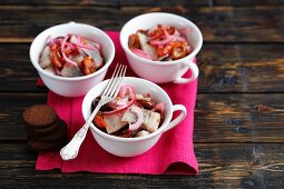 Herring with plums and red onions