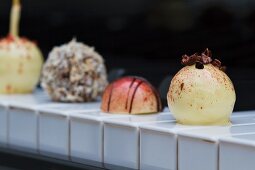 Various pralines on the keys of a piano