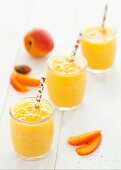 Glasses of apricot and mango smoothies