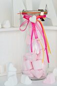 Pink, heart-shaped mashmallows in a glass bottle as a gift