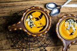 Pumpkin soup with flaked almonds and pumpkin seed oil