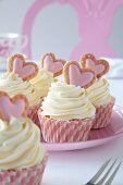 Romantic swirl cupcakes decorated with pink hearts for Valentine's Day