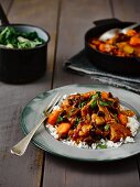 Feijoada (Brazilian stew with beans and meat) on a bed of rice