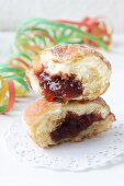Doughnuts with jam on paper doilies