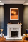 Open fireplace with marble surround on black chimney breast in elegant interior