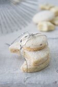 Vanilla biscuits and star anise biscuits tied with tinsel