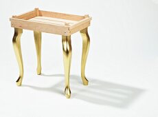 DIY tray table with golden legs made from wooden laths