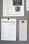 Various menus stuck on wall