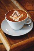 Coffee with a milk foam pattern