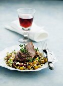 Lamb with diced potatoes, tender wheat and thyme
