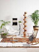 Classic chair, designer standard lamp, simple rocking chair and house plants