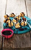 Banoffee cream puffs with chocolate sauce