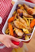 Oven baked chicken legs with root vegetables and yellow beans