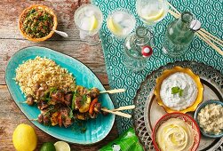 Lamb skewers with couscous and dips (Lebanon)