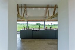 Breakfast bar and glass wall in modern kitchen
