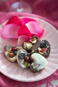 Heart-shaped chocolates with dried fruit and nuts