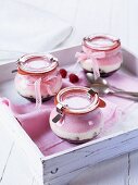 Raspberry cheesecake in glasses as gifts