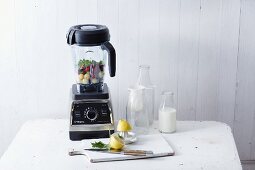 A blender and kitchen utensils for making smoothies