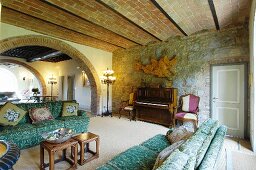 Stone wall and arches in Mediterranean living room