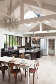 Kitchen and dining table below exposed roof structure