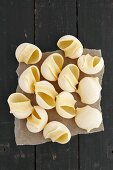 Conchiglie on a rustic wooden table