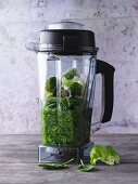 Green smoothie ingredients in a blender