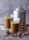 Goji berry and pineapple smoothies with cashew nuts, moringa and barley grass