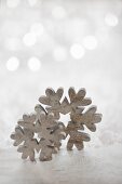 Wooden snowflakes against blurred background