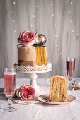 Chiffon cake with roses and sparkling rosė wine for Christmas