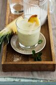 A pineapple and coconut smoothie with mint
