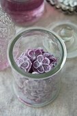 A jar of violet sweets