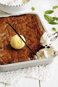 Chocolate brownie with vanilla ice cream and cream