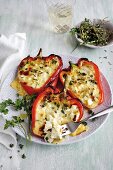 Red bell pepper halves stuffed with three kinds of cheese