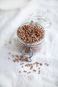 Organic lentils in a jar on a linen cloth