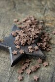Chocolate stars on wooden surface