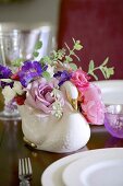 Romantic bouquet in swan-shaped vase