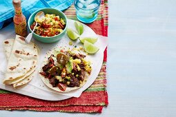 Wheat tortilla with beef and tomato-corn salsa