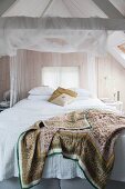 Romantic attic bedroom with board walls