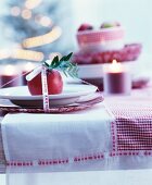 Decorative Advent place setting on red and white checked tablecloth