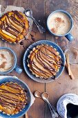 Vegan pear and pumpkin tartlets drizzled with chocolate