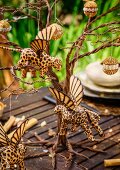 Table set for Christmas dinner in garden with elegant African-style decorations