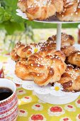 Almond pastries with sugar nibs on a cake stand