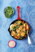 Shrimps with fried rice, spinach, chilli and sesame seeds